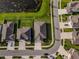 Aerial view of a neighborhood in a new housing development with a small pond at 11818 Tetrafin Dr, Riverview, FL 33579