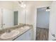 Bathroom featuring dual sink vanity with granite countertop at 11818 Tetrafin Dr, Riverview, FL 33579