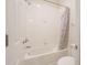 Bright bathroom featuring white tile, shower with curtain, and toilet at 11818 Tetrafin Dr, Riverview, FL 33579