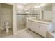 Modern primary bathroom features a frameless glass shower, granite countertop vanity, and tile flooring at 11818 Tetrafin Dr, Riverview, FL 33579