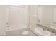Well lit bathroom featuring a shower/tub combo and granite countertop vanity at 11818 Tetrafin Dr, Riverview, FL 33579