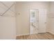 Walk-in closet adjacent to a bright bathroom with a bathtub at 11818 Tetrafin Dr, Riverview, FL 33579
