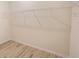 Walk-in closet featuring custom shelving and wood-look tile flooring at 11818 Tetrafin Dr, Riverview, FL 33579