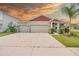 Beautiful single-story home with a 3-car garage and mature landscaping at 11818 Tetrafin Dr, Riverview, FL 33579