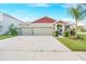 Beautiful single-story home with a 3-car garage and mature landscaping at 11818 Tetrafin Dr, Riverview, FL 33579