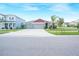 Charming single-story home featuring a well-maintained lawn and a three-car garage at 11818 Tetrafin Dr, Riverview, FL 33579