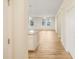 Hallway view featuring an island and view of the living room at 11818 Tetrafin Dr, Riverview, FL 33579