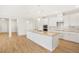 Spacious kitchen featuring a granite island, stainless appliances and pendant lighting at 11818 Tetrafin Dr, Riverview, FL 33579