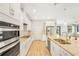 Kitchen with stainless appliances, granite countertops, and adjacent dining area at 11818 Tetrafin Dr, Riverview, FL 33579