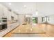 Open kitchen with granite island, stainless appliances and view to backyard at 11818 Tetrafin Dr, Riverview, FL 33579