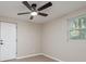 Bedroom featuring updated flooring, one window, and a ceiling fan at 709 1St Ne Ave, Largo, FL 33770