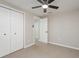 Bedroom featuring an open doorway, a closet with double doors, and a ceiling fan at 709 1St Ne Ave, Largo, FL 33770