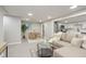 Bright living room featuring modern decor, recessed lighting, and open access to the kitchen at 709 1St Ne Ave, Largo, FL 33770