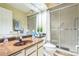 Bathroom with updated sink, vanity and shower at 3805 E Bay Dr # 204, Holmes Beach, FL 34217