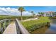Path and landscaping near waterfront at 3805 E Bay Dr # 204, Holmes Beach, FL 34217