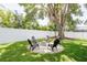 Outdoor fire pit area with chairs and privacy fence at 3920 Basswood Dr, Sarasota, FL 34232