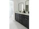 Modern bathroom features a double vanity and sleek walk-in shower at 3920 Basswood Dr, Sarasota, FL 34232