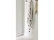 White wall corner with a striped towel and decorative bathroom accessories at 3920 Basswood Dr, Sarasota, FL 34232