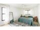 Bright bedroom with minimalist decor, including an area rug and two windows at 3920 Basswood Dr, Sarasota, FL 34232