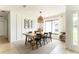 Bright dining room with modern lighting fixture and lots of natural light at 3920 Basswood Dr, Sarasota, FL 34232