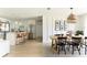 Bright, open-concept kitchen and dining area with stainless steel appliances and a large island at 3920 Basswood Dr, Sarasota, FL 34232