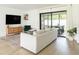 Cozy living room with a modern rug and natural light leading to the patio at 3920 Basswood Dr, Sarasota, FL 34232