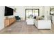Cozy living room with a modern rug and natural light leading to the patio at 3920 Basswood Dr, Sarasota, FL 34232