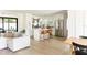 Open-concept living space with modern kitchen, dining area, and comfortable seating at 3920 Basswood Dr, Sarasota, FL 34232