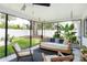 Outdoor patio featuring a swing bench with comfortable seating and a view of the backyard at 3920 Basswood Dr, Sarasota, FL 34232