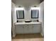Bathroom featuring double sinks and a granite countertop at 10533 Hazel St, Largo, FL 33778