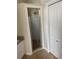This bathroom features a tiled shower with a glass door at 10533 Hazel St, Largo, FL 33778