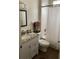 Cozy bathroom with a granite vanity, framed mirror, and a shower-tub combo at 10533 Hazel St, Largo, FL 33778