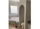 Bathroom featuring a jacuzzi tub and a tiled shower at 10533 Hazel St, Largo, FL 33778