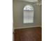 Bedroom with hardwood floors and a large window providing natural light at 10533 Hazel St, Largo, FL 33778