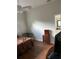 Bedroom with hard wood floors featuring an ensuite bathroom at 10533 Hazel St, Largo, FL 33778