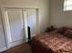 Bedroom featuring hard wood floors and a sliding glass door with a view at 10533 Hazel St, Largo, FL 33778