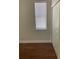 Bedroom with laminate wood floors, a large window, and a bi-fold closet door at 10533 Hazel St, Largo, FL 33778