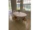Cozy breakfast nook with large windows and a floral tablecloth at 10533 Hazel St, Largo, FL 33778