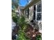 Attractive home featuring manicured landscaping, dark shutters, and an inviting side exterior at 10533 Hazel St, Largo, FL 33778