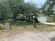 Charming single-story home with a well-maintained lawn, mature trees, and a 