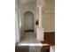 Welcoming hallway features tiled floors, decorative columns, and arched doorway at 10533 Hazel St, Largo, FL 33778