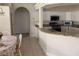 Kitchen and breakfast nook area featuring white cabinets and granite countertops at 10533 Hazel St, Largo, FL 33778