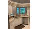 Eat-in kitchen area featuring granite counters and stainless dishwasher at 10533 Hazel St, Largo, FL 33778