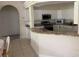 Well-lit kitchen featuring granite countertops, stainless steel appliances, and ample counter space at 10533 Hazel St, Largo, FL 33778