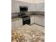 Close up of the kitchen featuring stainless steel appliances and granite countertops at 10533 Hazel St, Largo, FL 33778