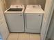 A modern laundry room with a side-by-side Samsung washer and dryer set at 10533 Hazel St, Largo, FL 33778