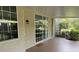 The spacious screened patio provides an airy extension of the home with natural light and garden views at 10533 Hazel St, Largo, FL 33778