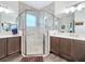 Bathroom featuring a glass shower, neutral tile, and modern fixtures at 15503 Corona Del Mar Dr, Wimauma, FL 33598