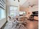 Bright dining area adjacent to the living room with natural light and sliding glass doors at 15503 Corona Del Mar Dr, Wimauma, FL 33598