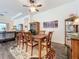 Open-concept dining room with a classic table set and views into the living area at 15503 Corona Del Mar Dr, Wimauma, FL 33598